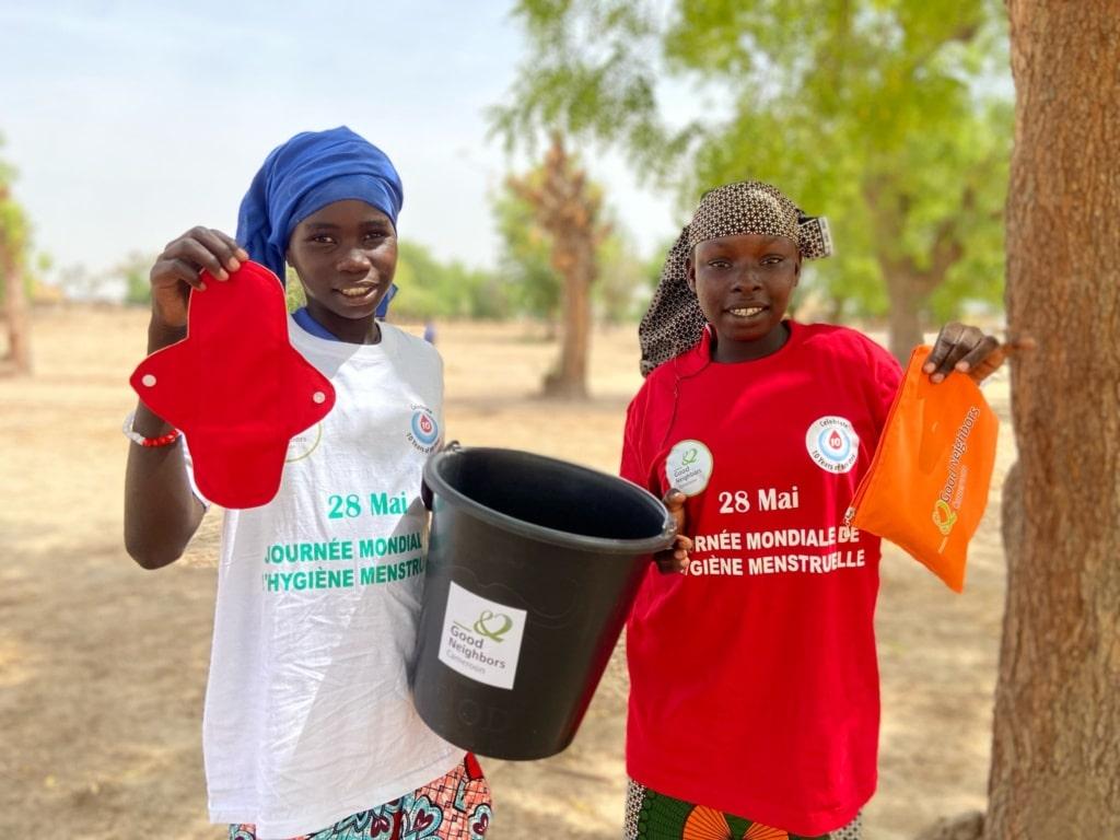 Young girls in Cameroon receiving their menstrual and sanitation kit from the Better Life for Girls seminar